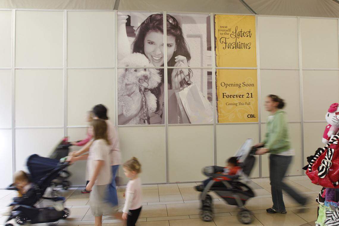 Signs informing customers of changes and renovations in Fayette Mall in 2011, including the opening of Forever 21, that fall.