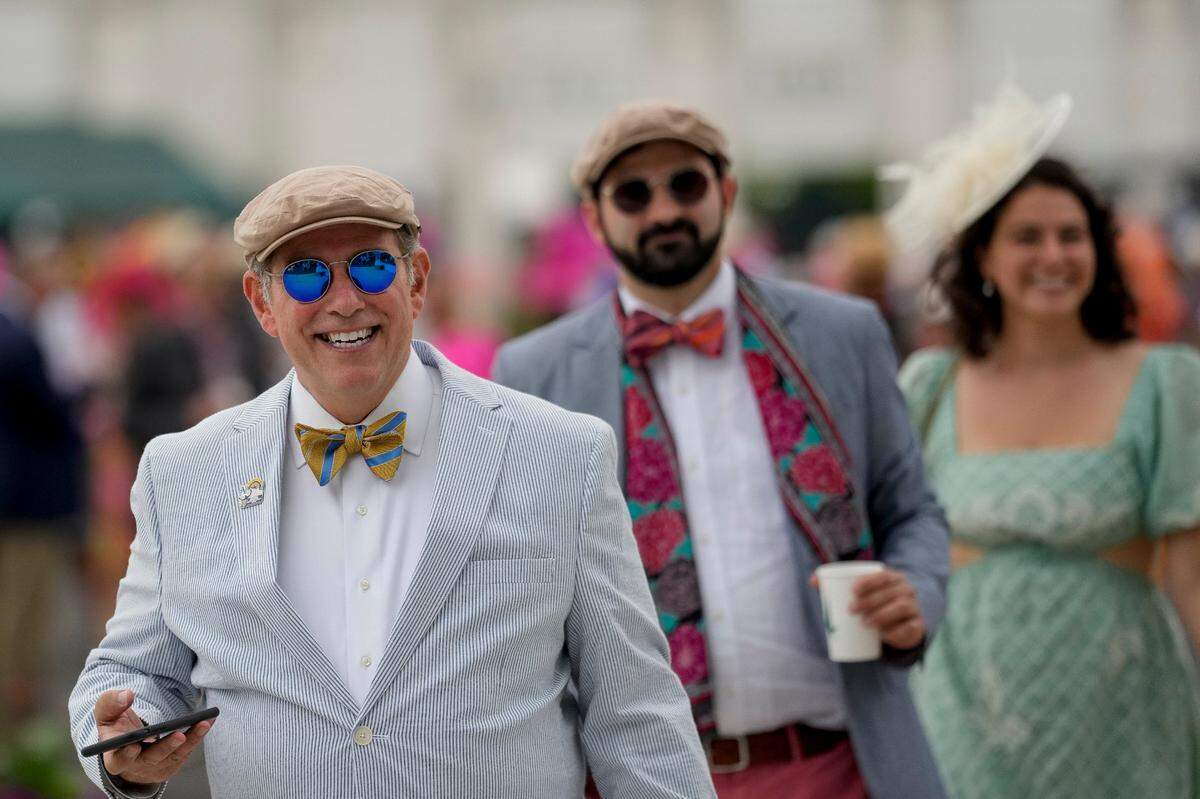 Spectators arrive at Churchill Downs on the day of the 149th running of the Kentucky Derby Saturday, May 6, 2023, in Louisville, Ky. (For the Herald Leader/Bryan Woolston)