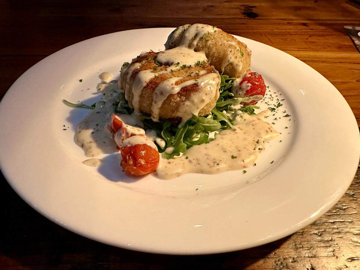 Crab cake appetizer at The Obstinate Sons restaurant, a new restaurant and bourbon bar, that opened in Chevy Chase, from Dexter Murray and Cannon Applegate, serving elevated comfort food and vintage bourbon.