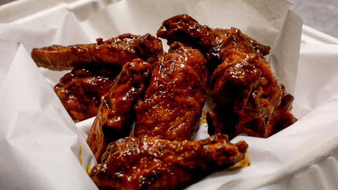 Smoked chicken wings with a Sriracha sauce from O’Brothers Smokehouse in the Fish Tank Bar.