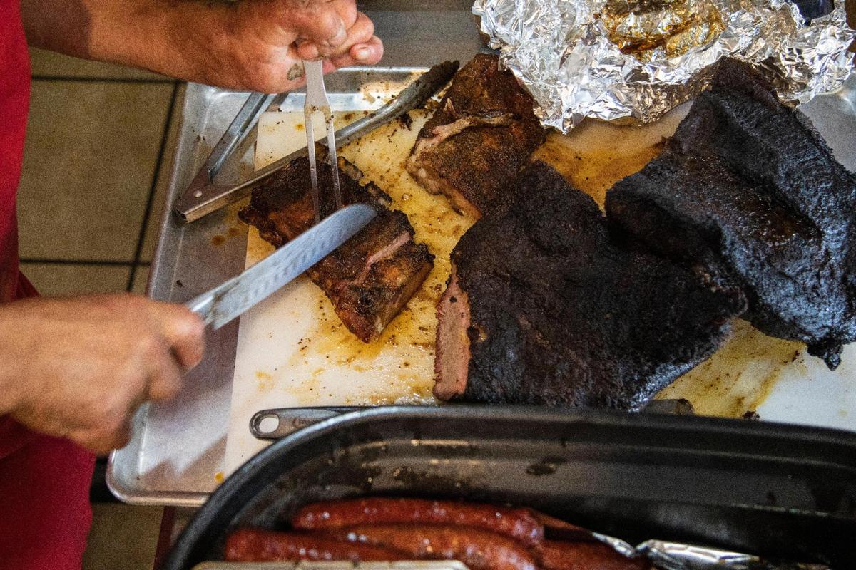 Owner Paul Morin works serving food and cutting brisket at Straight from Texas Bar-B-Que in Richmond, Ky., Thursday, May 6, 2021. The restaurant suffered a fire on March 19, 2026, that may put it out of commission until it can be rebuilt.