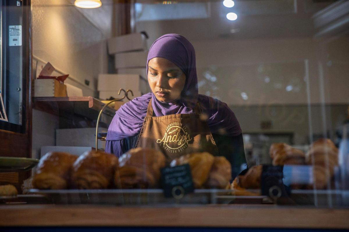 Narimane Kayed Mahamoud, a bakery assistant, plates the day’s offerings of sweet and savory baked goods at Andy’s Artisan Bread at 127 E. Todd St. in Frankfort, Ky., on Thursday, July 21, 2022.