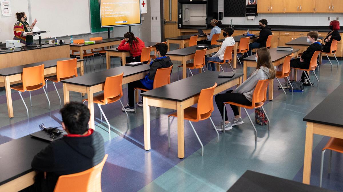 Students sit at individual desks in a classroom during the first day of returned in-person learning at Frederick Douglass High School in Lexington, Ky, Monday, March 8, 2021. Every classroom has desk shields that can be made available to students upon request.