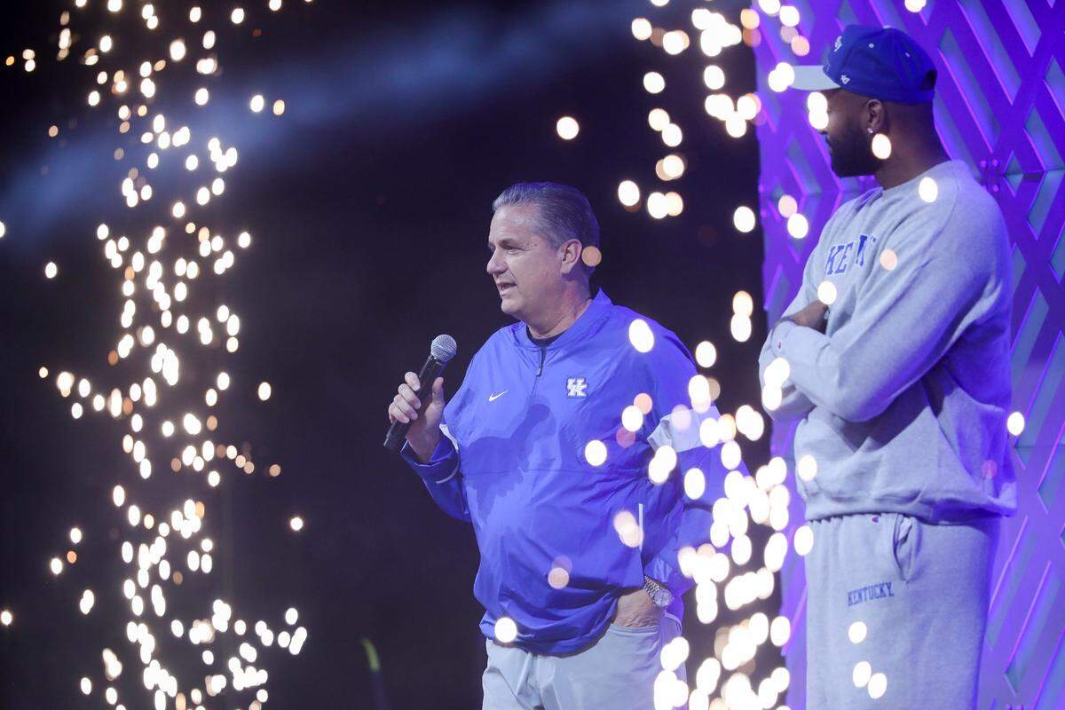 Kentucky head coach John Calipari greets UK fans at Big Blue Madness in Rupp Arena on Friday night after being introduced by former Wildcat DeMarcus Cousins.