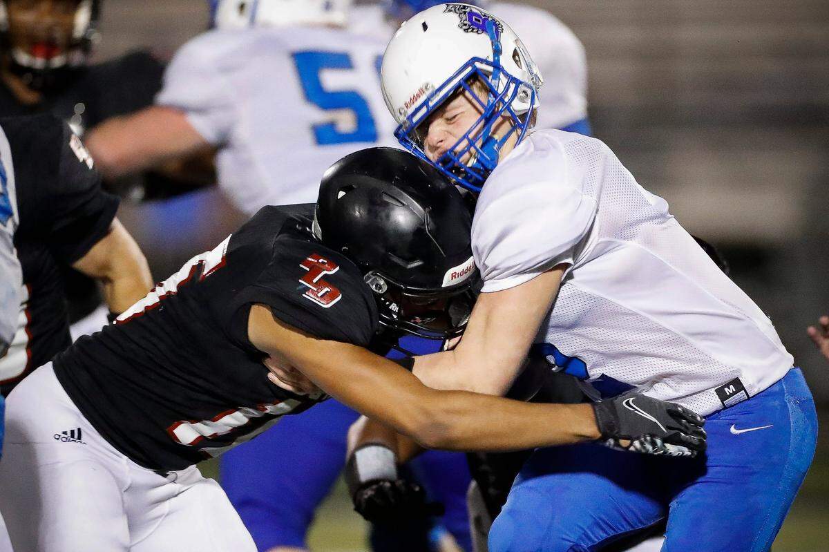 Paul Laurence Dunbar’s Peyton Davis, left, tackled Breathitt County’s Jason Tolson during Friday’s game.