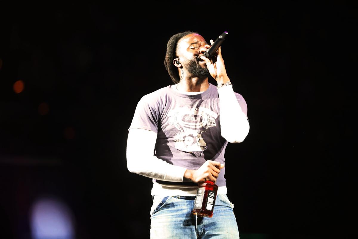 Grammy-nominated musician, singer, songwriter, and record producer Shaboozey performed with a bottle of whisky at Rupp Arena on November 8, 2024, in Lexington, Ky.