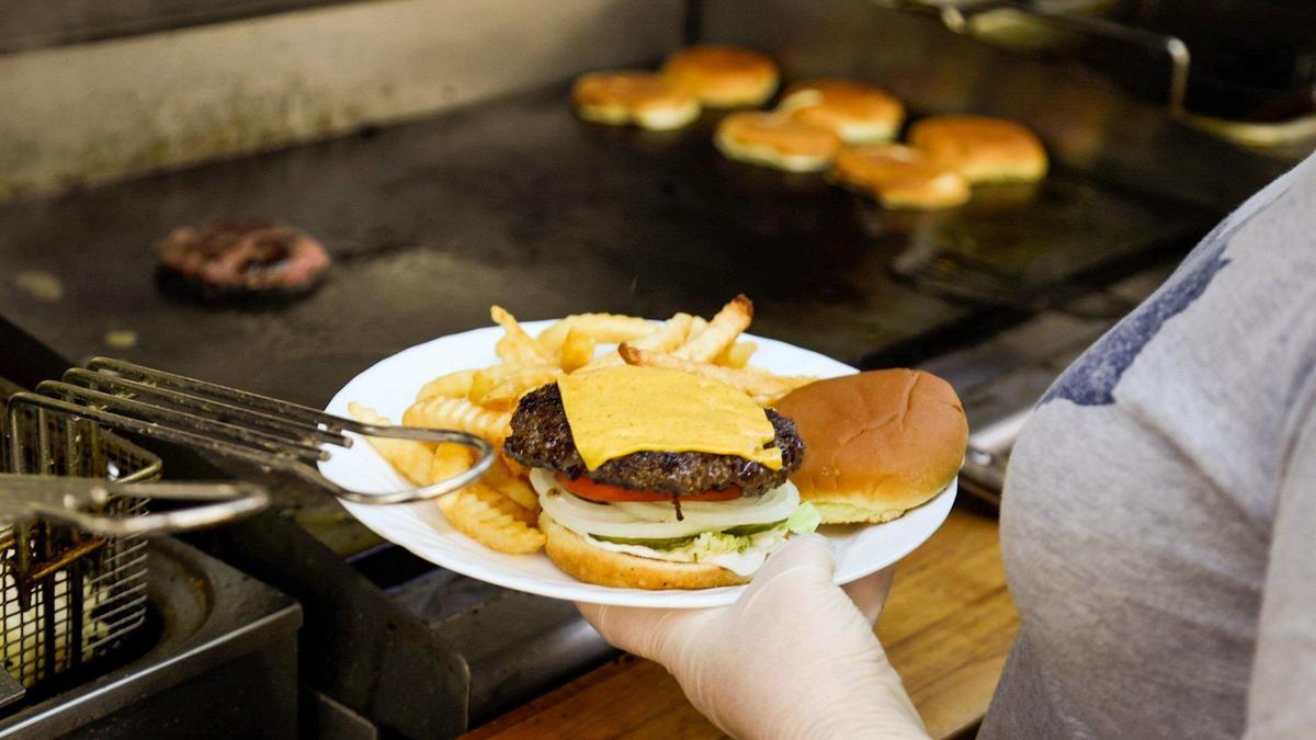Cheeseburgers are a popular menu item off the flat top grill at the Osman Pharmacy in Vanceburg.