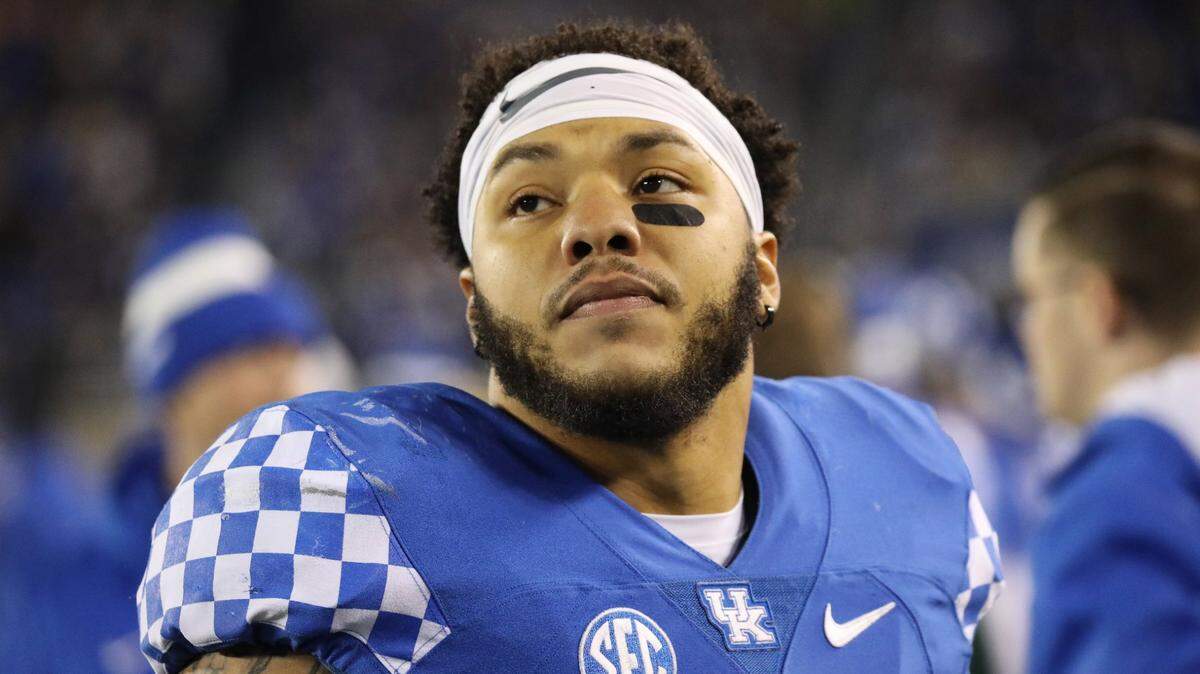 Kentucky running back Chris Rodriguez Jr. (24) was arrested Sunday morning and charged with operating a motor vehicle under the influence of alcohol, careless driving and driving without tail lamps.