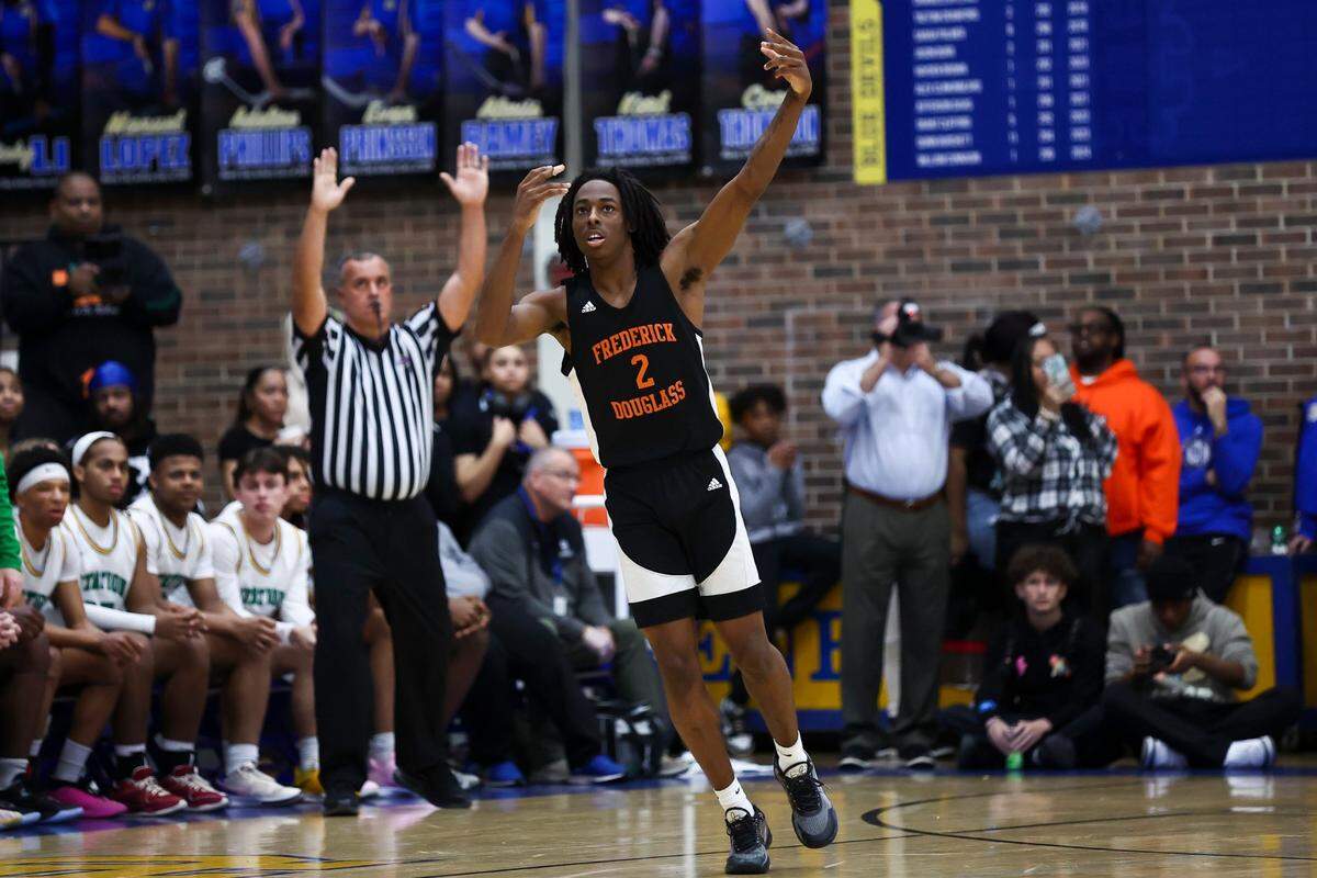 Frederick Douglass’ Aveion Chenualt (2) celebrates scoring against Henry Clay during the 42nd District Tournament championship game on March 1.
