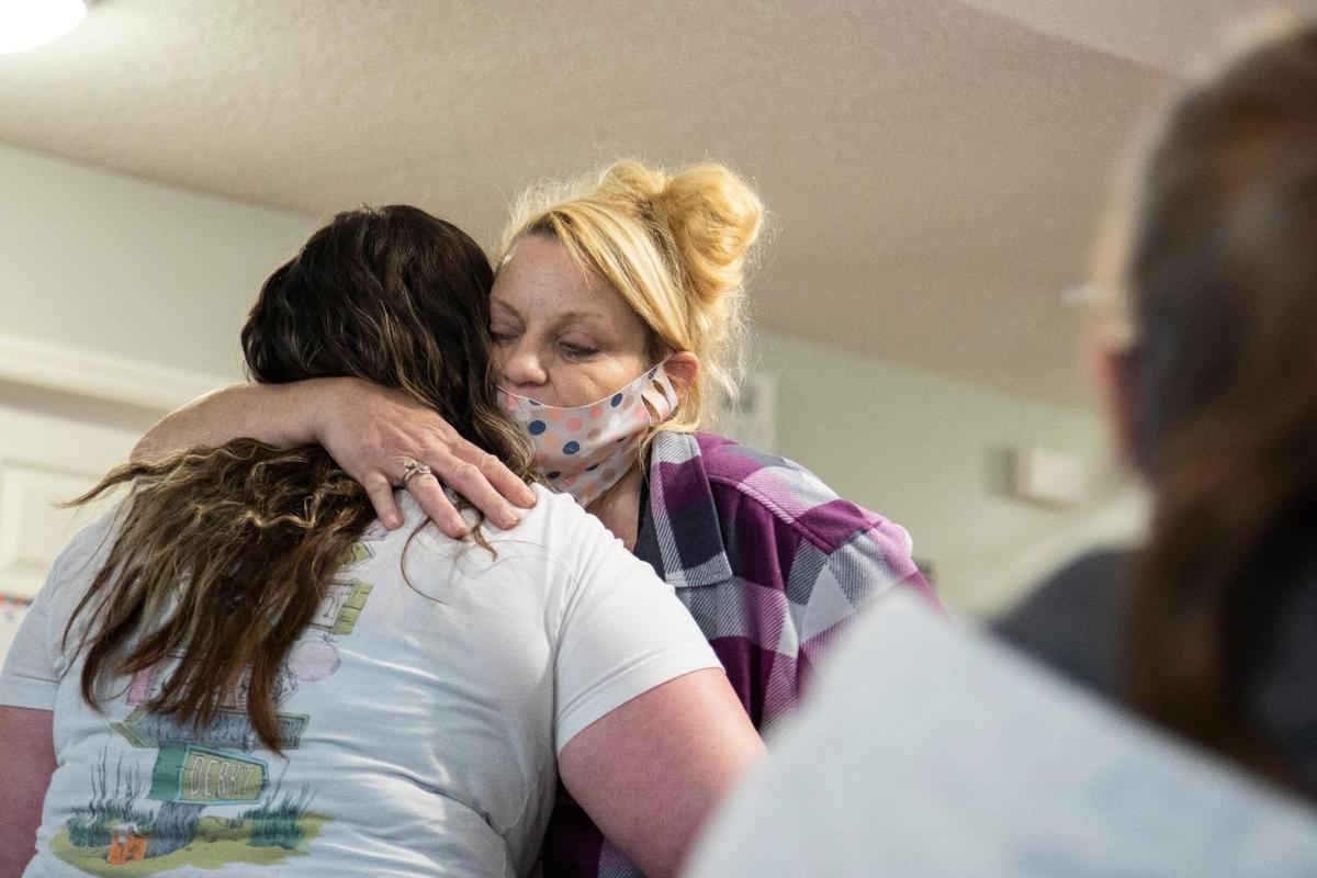Megan Simpson says goodbyes to her friends on the day of her graduation from the Women’s Addiction Recovery program at the Freedom House in Manchester, Ky., Thursday, April 15, 2021.