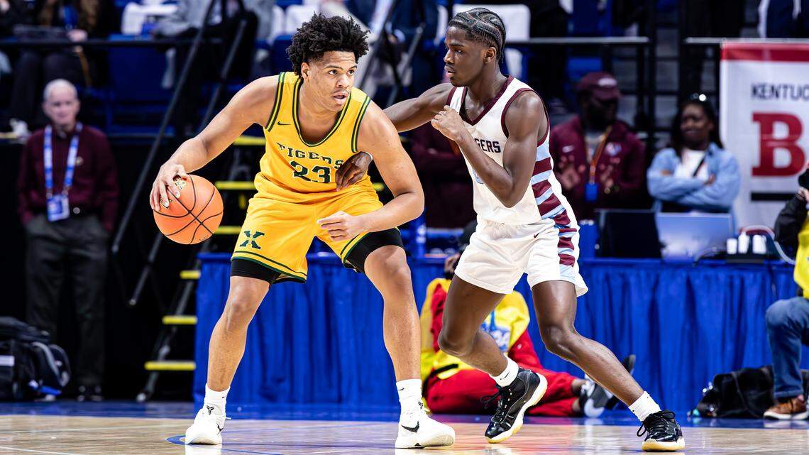 St. Xavier’s Jeremiah Jackson (23) looks to develop a play while guarded by Jeffersontown’s Prince Kahnplaye during the first round of the UK HealthCare Boys’ Basketball Sweet 16 at Rupp Arena on March 26. St. X is the Herald-Leader’s preseason No. 1 for 2025-26.