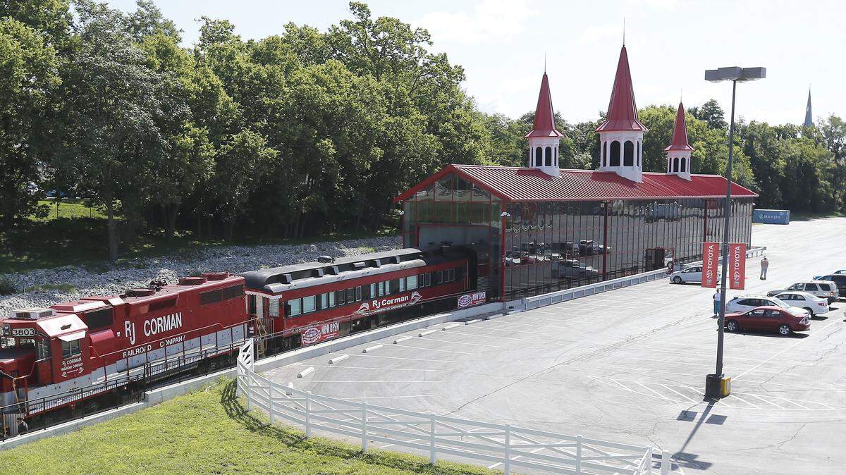 The R.J. Corman Railroad Co.'s glass-walled train holding station, which sits on Lexington Center property, will be removed under the terms of a settlement announced Tuesday in U.S. District Court.  