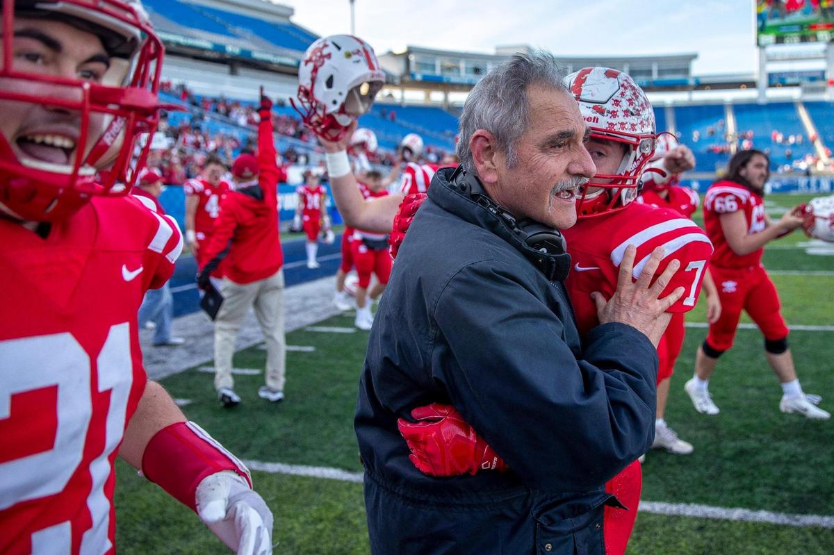 Belfry head coach Philip Haywood celebrates with his team after the Pirates’ 33-28 victory.