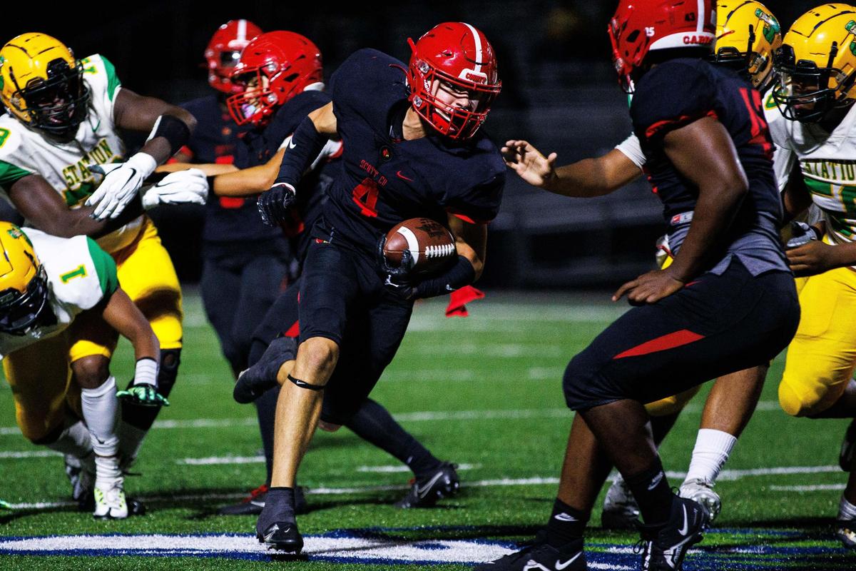 Scott County safety Paul Garner returns an interception against Bryan Station that set up the Cardinals’ go-ahead touchdown in the fourth quarter on Friday night.