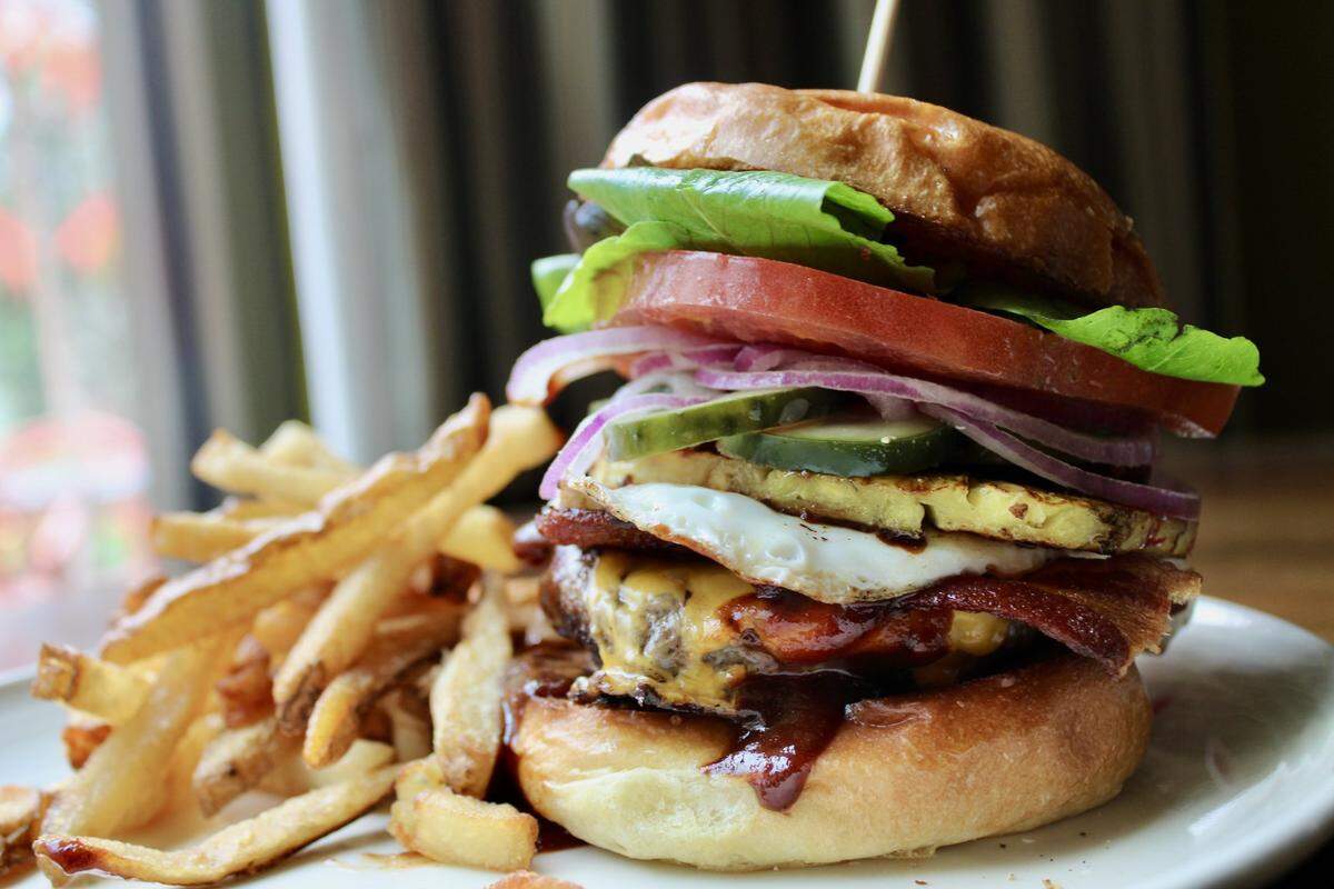 Zim’s Cafe will have Australia’s Famous Burger with Lot – The giant Aussie burger: Two quarter-pound Stonecross beef patties, cheddar cheese, bacon, fried egg, lettuce and tomato, onions pickles, beetroot, fresh pineapple, our Kentucky BBQ sauce with Fries.