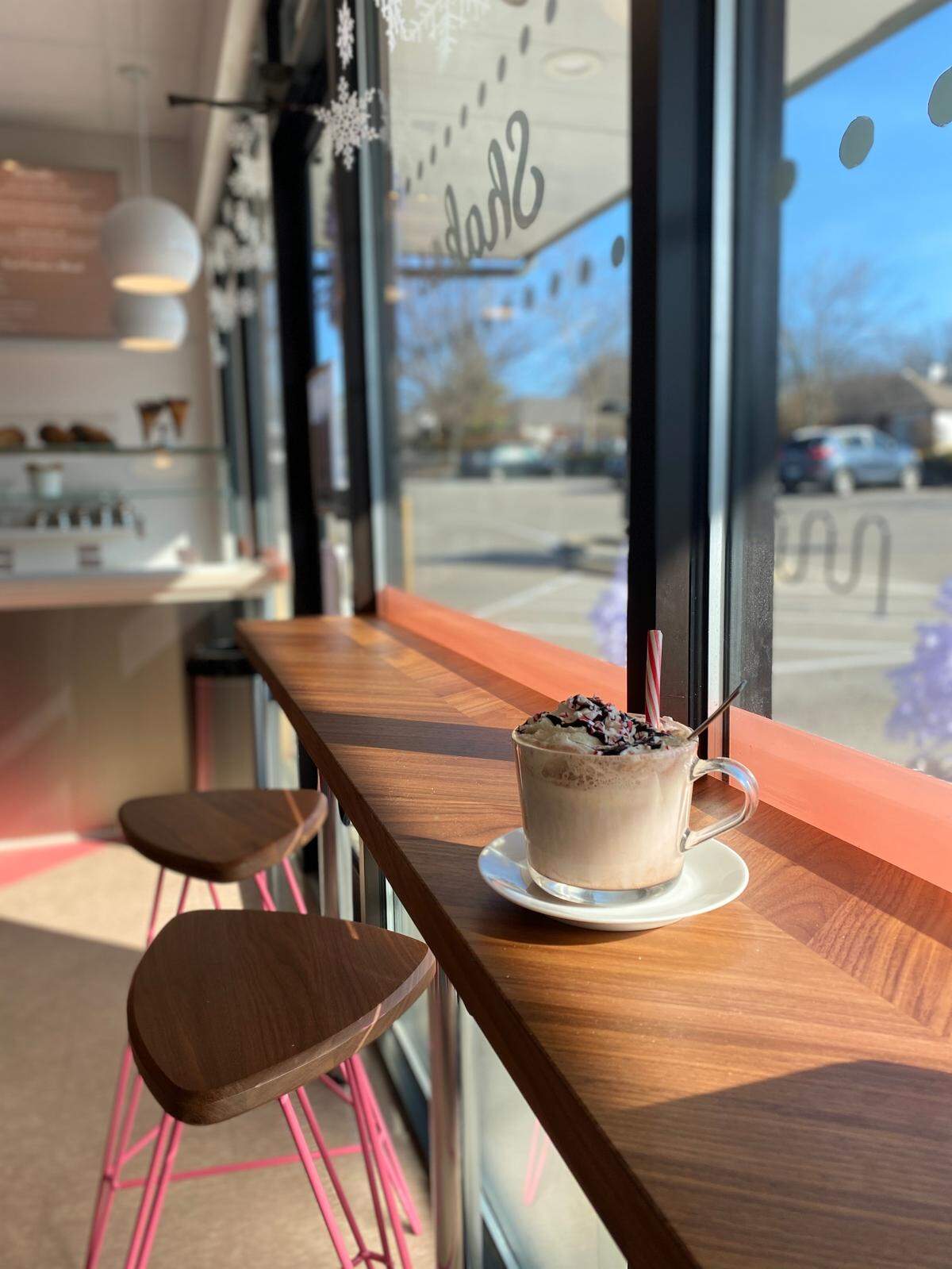 The Hot Chocolate Float at Freshie’s Ice Cream & Soda Fountain in Hartland is made with a scoop of classic vanilla ice cream and steaming hot chocolate, then topped with fresh, homemade whipped cream, crushed candy canes and a dark chocolate drizzle. It’s served in a glass mug with a candy cane.