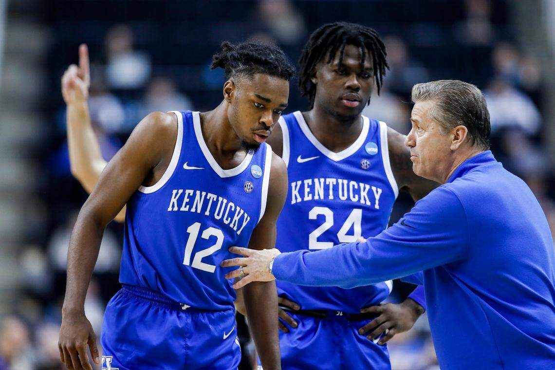 Kentucky Wildcats head coach John Calipari talks with guard Antonio Reeves (12) and forward Chris Livingston (24) during the NCAA Tournament second round game at the Greensboro Coliseum in Greensboro, Nc., Sunday, March 19, 2023.