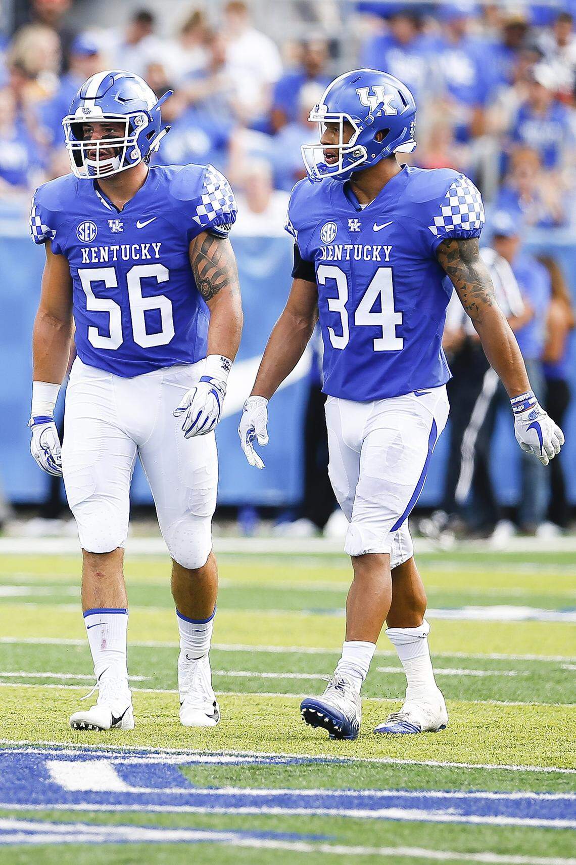 Kentucky inside linebackers Kash Daniel (56) and Jordan Jones (34) will both now be forced to play with a bulky apparatus on their hands after Jones injured his left hand at practice on Wednesday.