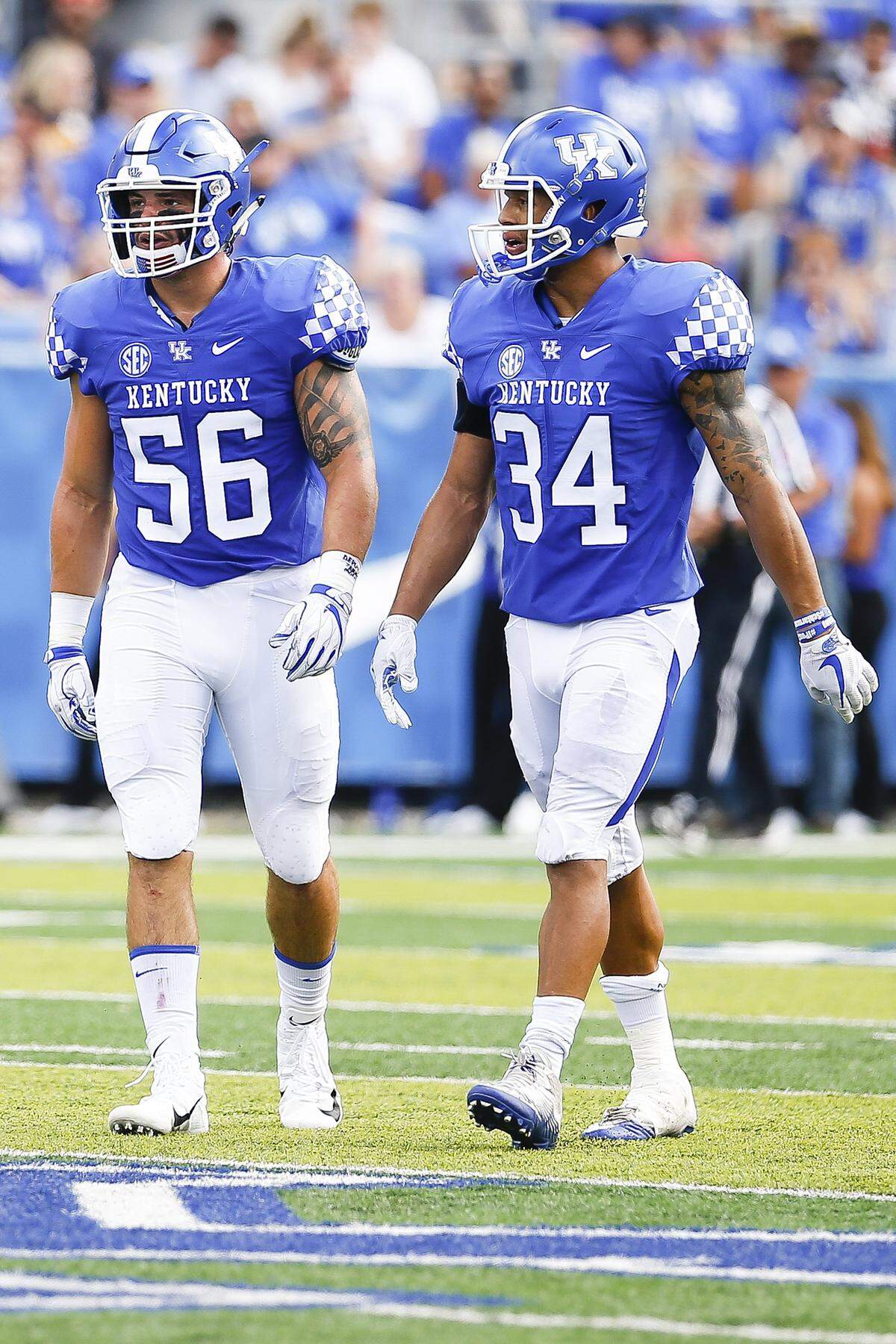 Kentucky inside linebackers Kash Daniel (56) and Jordan Jones (34) will both now be forced to play with a bulky apparatus on their hands after Jones injured his left hand at practice on Wednesday.