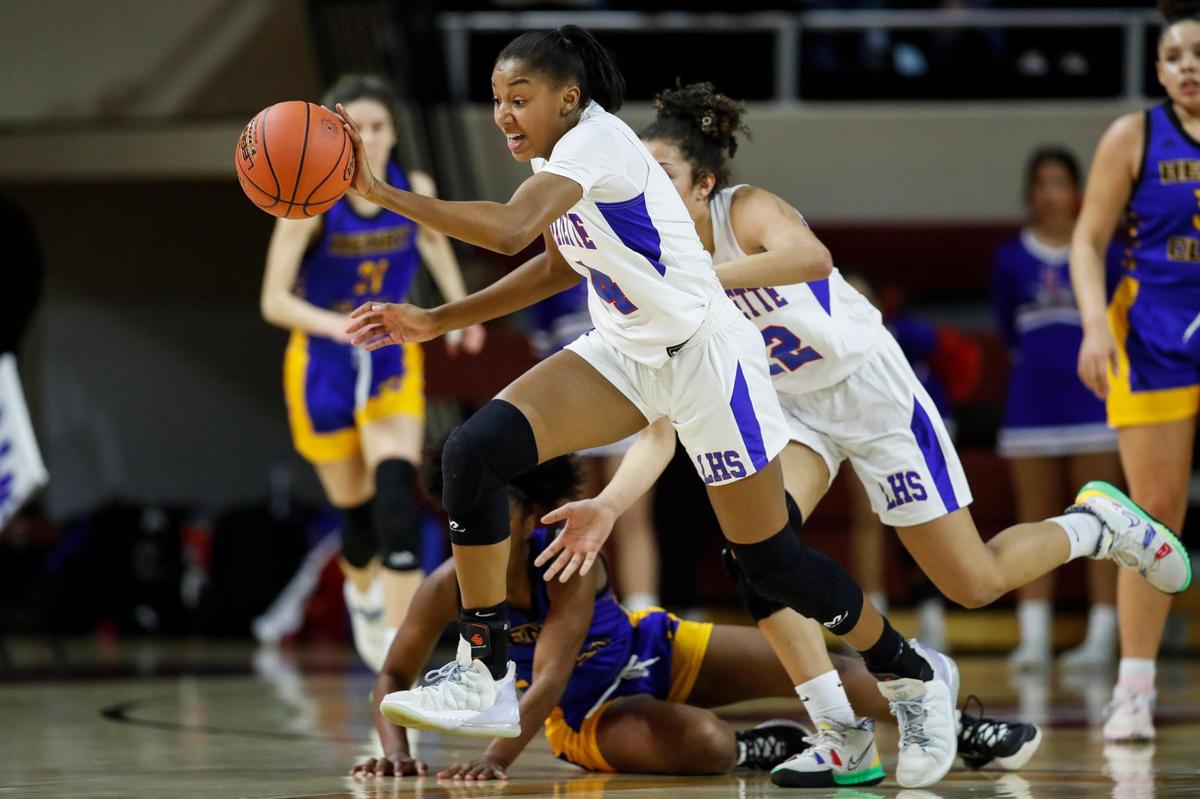 Lafayette’s Anaya Brown (4) steals the ball from Henry Clay’s Ariyanna Sutton (1) during Thursday night’s 11th Region semifinals at EKU. Brown finished the win with 23 points, nine rebounds, seven blocks and four steals.