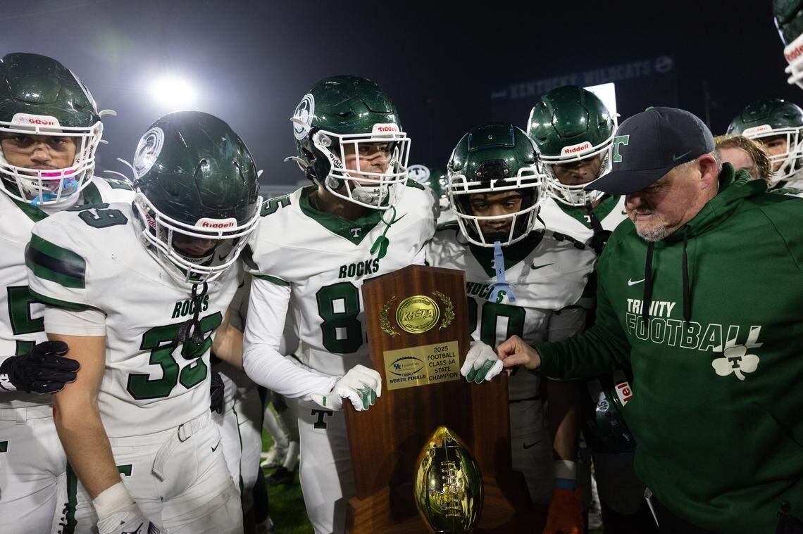Trinity players holding trophy during the Class 6A UK HealthCare Sports Medicine State Football Finals Saturday, December 6th, 2025 at Kroger Field in Lexington KY