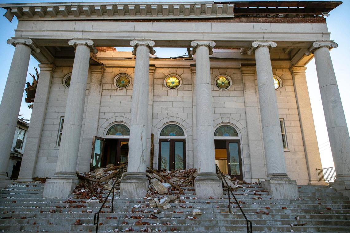 Rubble lies on the front steps of Mayfield’s First United Methodist Church Sunday.