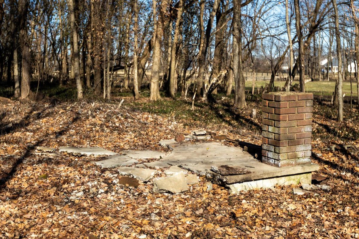 Remnants of a house porch are roped off as Woodford county and UK Architecture students preserve the historic Black community of Huntertown to convert into an interpretive park honoring the community. Jan. 26, 2022.