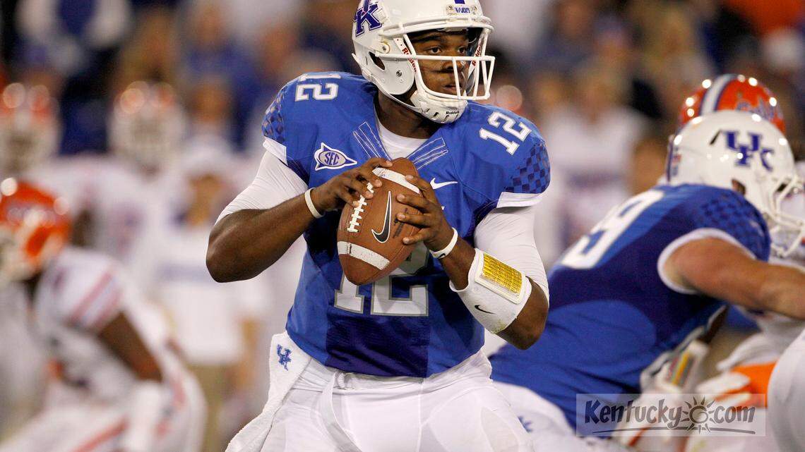 Kentucky Wildcats quarterback Morgan Newton (12) stood in the pocket in the first half of the University of Kentucky vs. University of Florida football game on Saturday, August 24, 2011 at Commonwealth Stadium.  Photo by David Perry  |  Staff