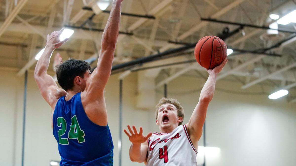 Aden Slone (4) of Clark County shoots over North Laurel’s Ryan Davidson (24) during a game earlier this season. Both schools are ranked in this week’s top five.