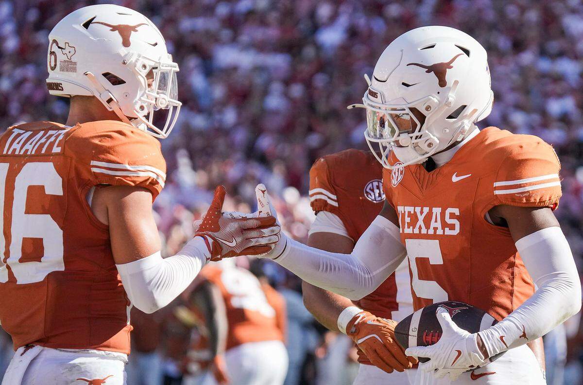 Texas cornerback Malik Muhammad (5) celebrated after one of his two interceptions in the Longhorns’ 23-6 upset of then-No. 6 Oklahoma last week.