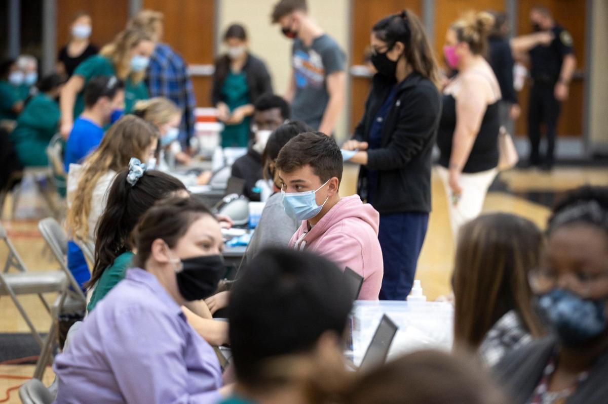 Paul Laurence Dunbar students receive the COVID-19 vaccination at the high school in Lexington, Ky., on Tuesday, April 27, 2021. The vaccines were administered at six Lexington high schools Tuesday and were available for students age 16 and older, their families and school staff.