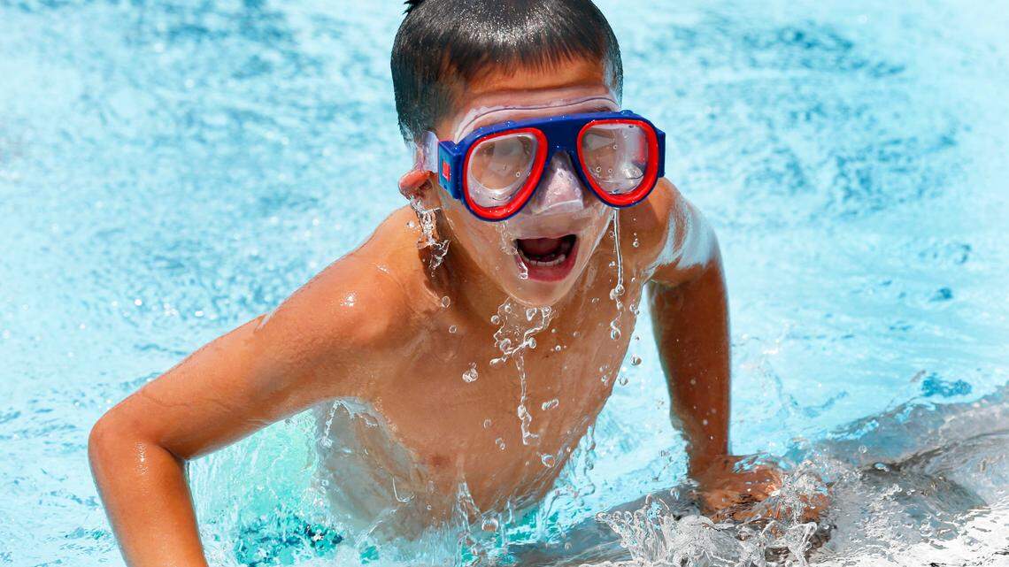 Martin Perez, 6, played in the pool on the opening day, May 22, of the Southland Aquatic Center, 625 Hill-n-Dale Road, in Lexington. Lexington had the hottest May on record, according to the National Weather Service.