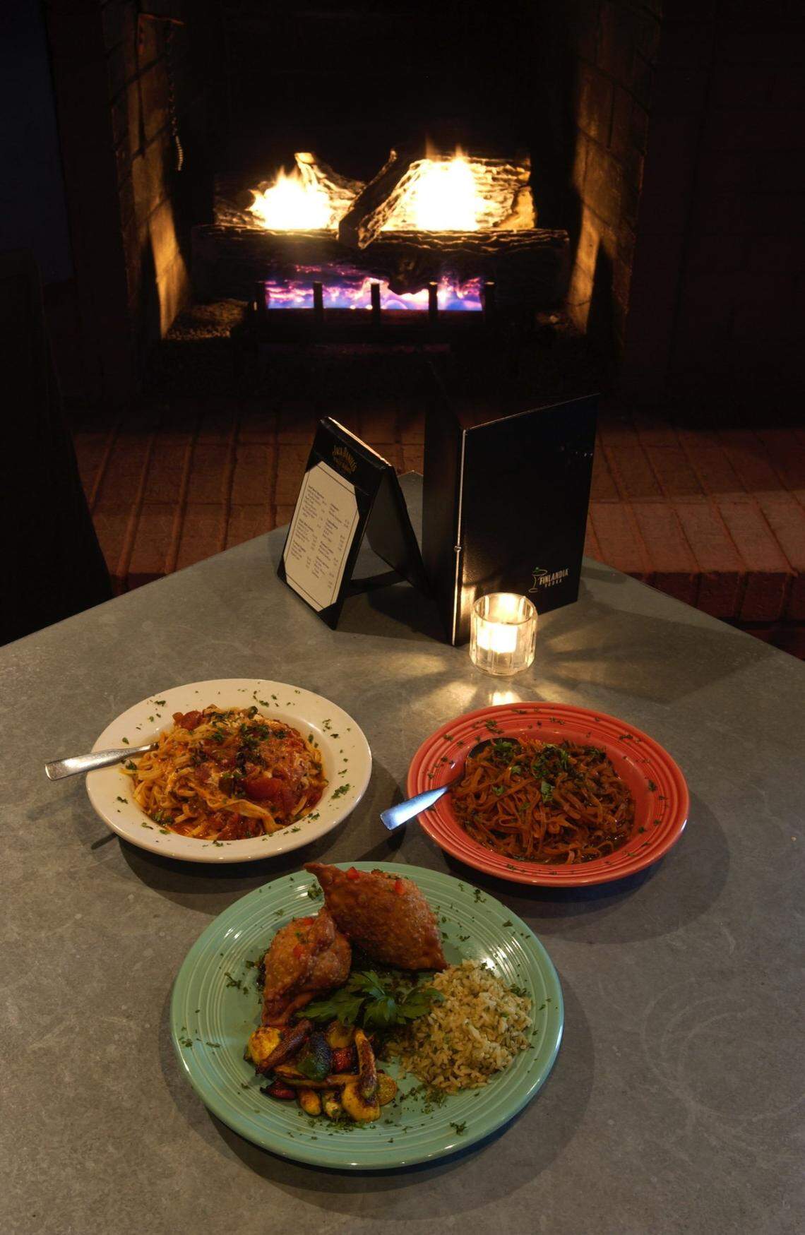 Clockwise from botttom, Brie and Wild Mushroom Empanada dinner, Linguine with Tomato and Herbs, and Lime Chile Pesto Linguine are some of the vegetarian dishes at Ed and Fred’s Desert Moon. Tuesday Sep 18, 2001.