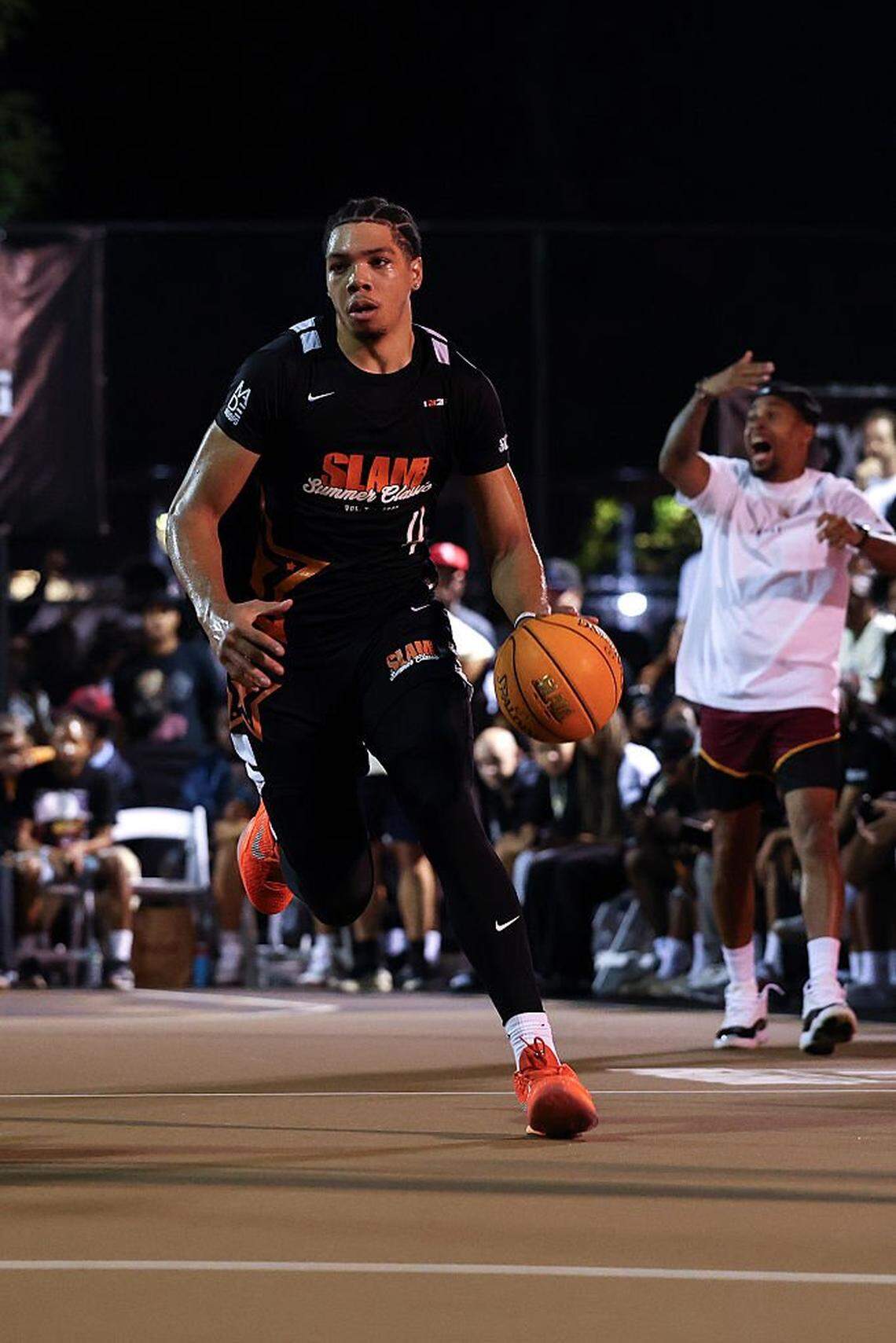 NEW YORK, NEW YORK - AUGUST 18: Class of 2026 recruit Tyran Stokes #4 dribbles the ball during the SLAM Summer Classic at Rucker Park on August 18, 2025 in New York City. (Photo by Ishika Samant/Getty Images)