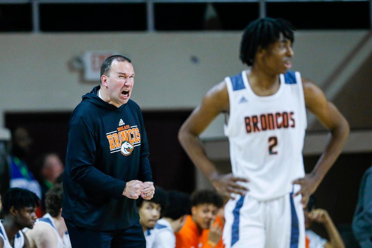 First-year Frederick Douglass head coach Wes Scarberry shouts in frustration after one of his players was called for a foul during the 11th Region Tournament.