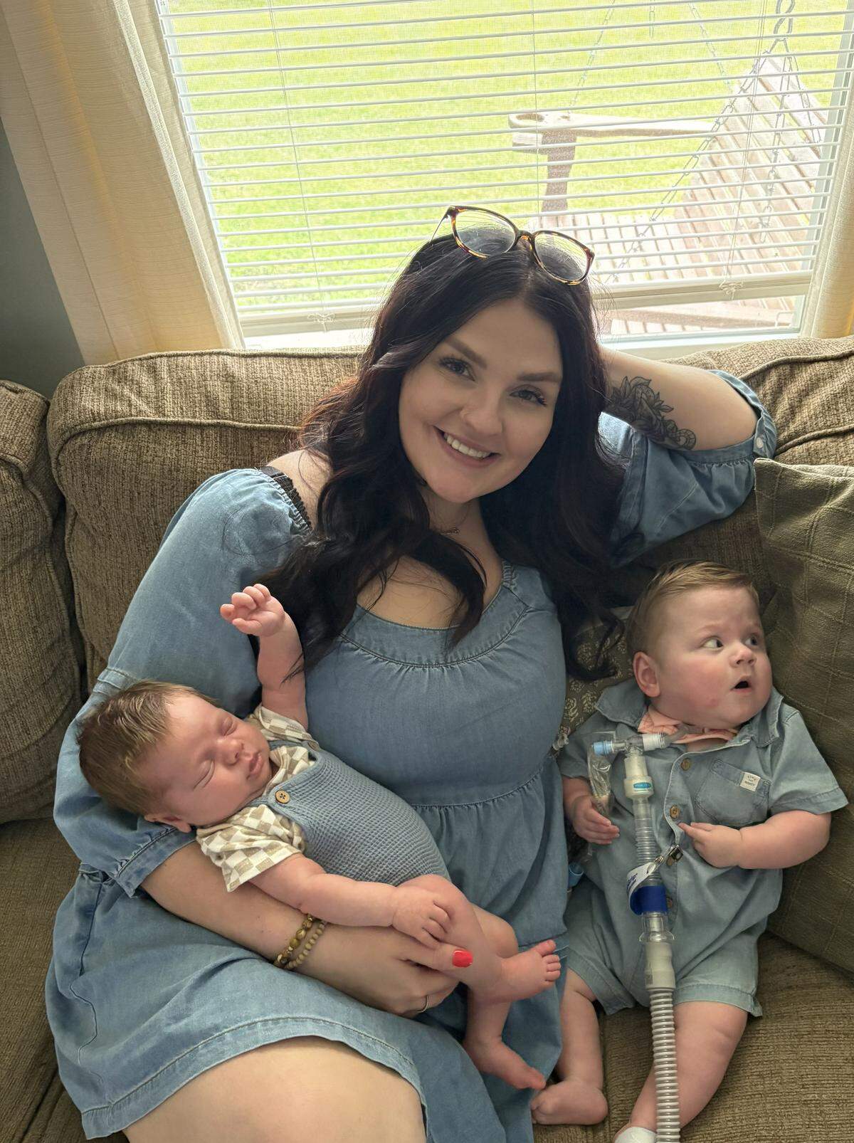 Savannah Jones held both her babies, newborn Everen, left, and Colsen, 14 months, at home in Waynesburg.