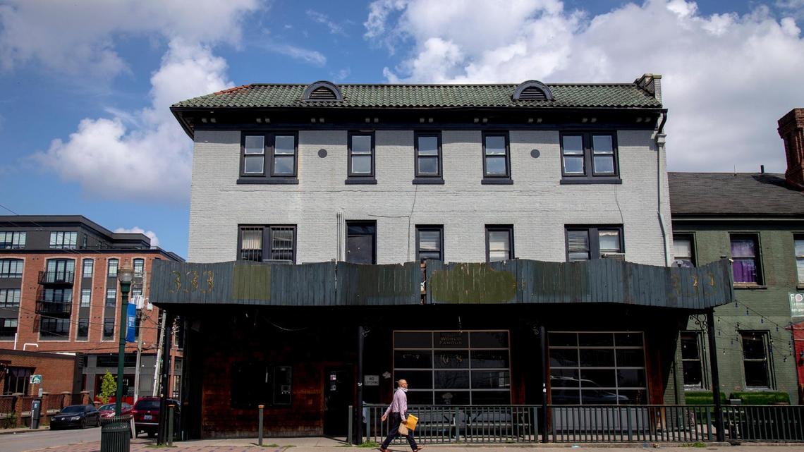 A man walks by the building that was the site of Two Keys Tavern for 66 years in Lexington, Ky., Aug. 3, 2020. The property was recently sold to a Louisville developer.