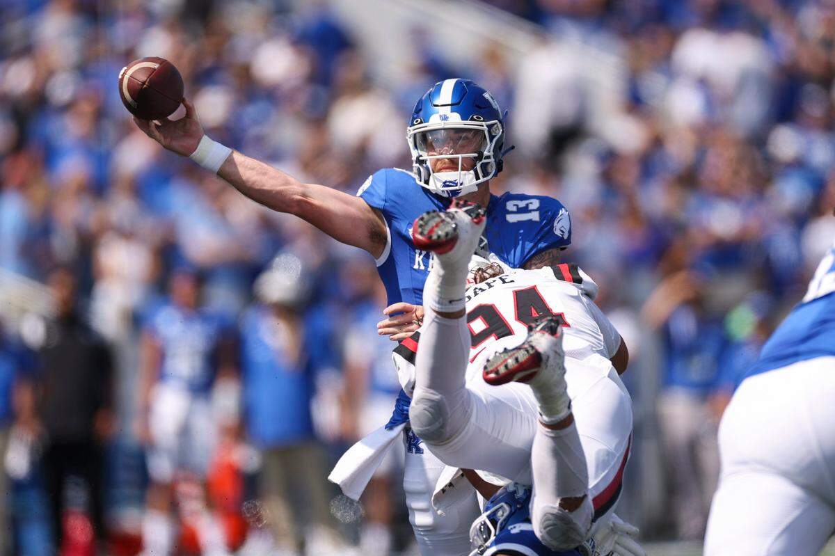 Devin Leary (13) threw for 241 yards and one touchdown with one interception in his Kentucky debut, a 44-14 victory against Ball State on Saturday at Kroger Field.