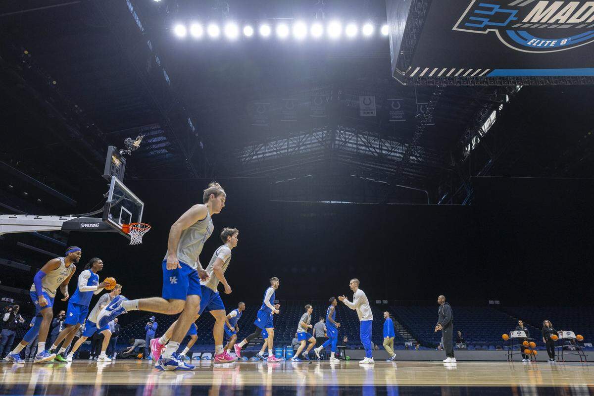 Kentucky players warm up during an open practice at Lucas Oil Stadium in Indianapolis on Thursday, a day before Kentucky’s NCAA Sweet 16 game against Tennessee.