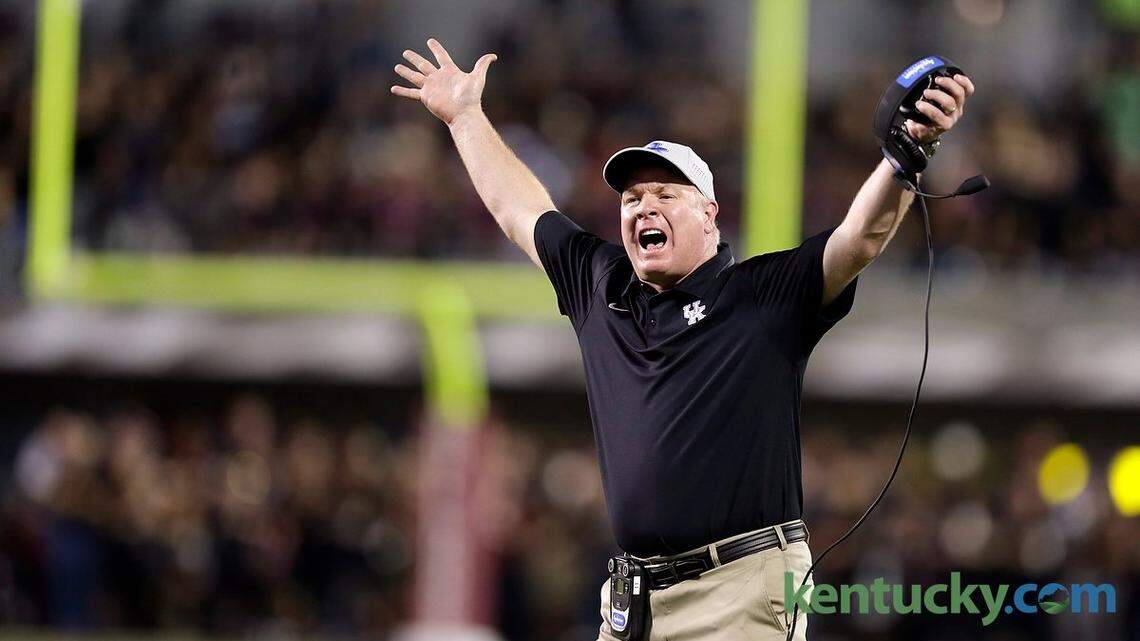 Kentucky Wildcats head coach Mark Stoops tried to get an official's attention in the second quarter of the Kentucky at Mississippi State football game at Davis Wade Stadium in Starkville, Miss., on Oct. 24, 2015. Photo by Pablo Alcala | Staff