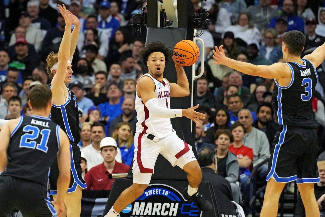 Mar 27, 2025; Newark, NJ, USA; Alabama Crimson Tide guard Mark Sears (1) passes the ball against Brigham Young Cougars guard Egor Demin (3) during the second half during an East Regional semifinal of the 2025 NCAA tournament at Prudential Center. Mandatory Credit: Robert Deutsch-Imagn Images