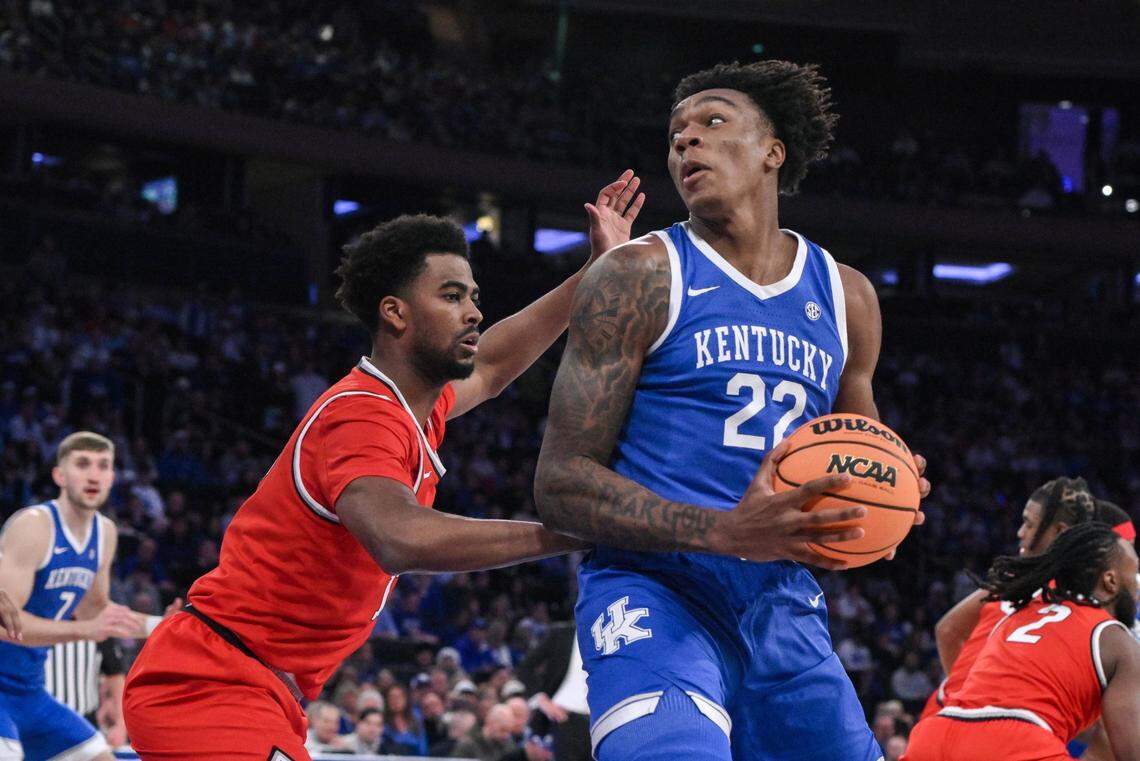 Dec 21, 2024; New York, New York, USA; Kentucky Wildcats center Amari Williams (22) posts up against Ohio State Buckeyes forward Sean Stewart (13) during the first half at Madison Square Garden. Mandatory Credit: John Jones-Imagn Images