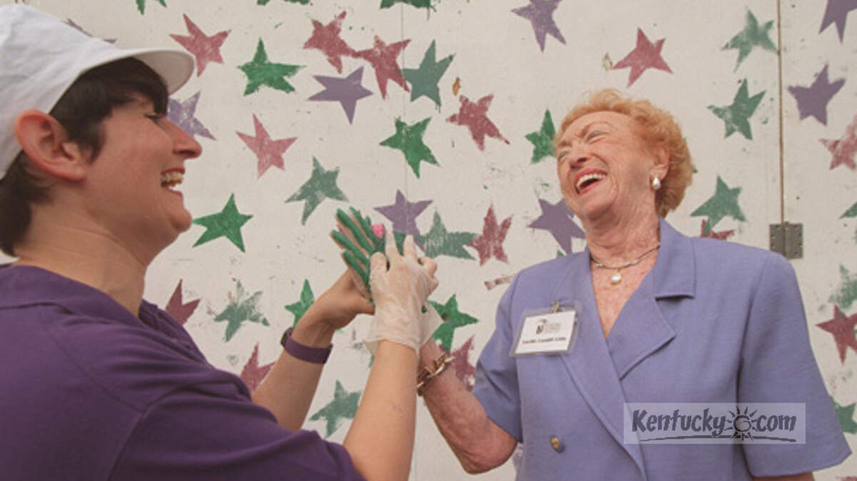 Lexington Children's Theatre artistic director Vivian Snipes shared a laugh with Lucille Caudill Little at a 1997 event that was a prelude to the construction of the the theater's Short Street facility. © Lexington Herald-Leader photo by Rob Sumner.