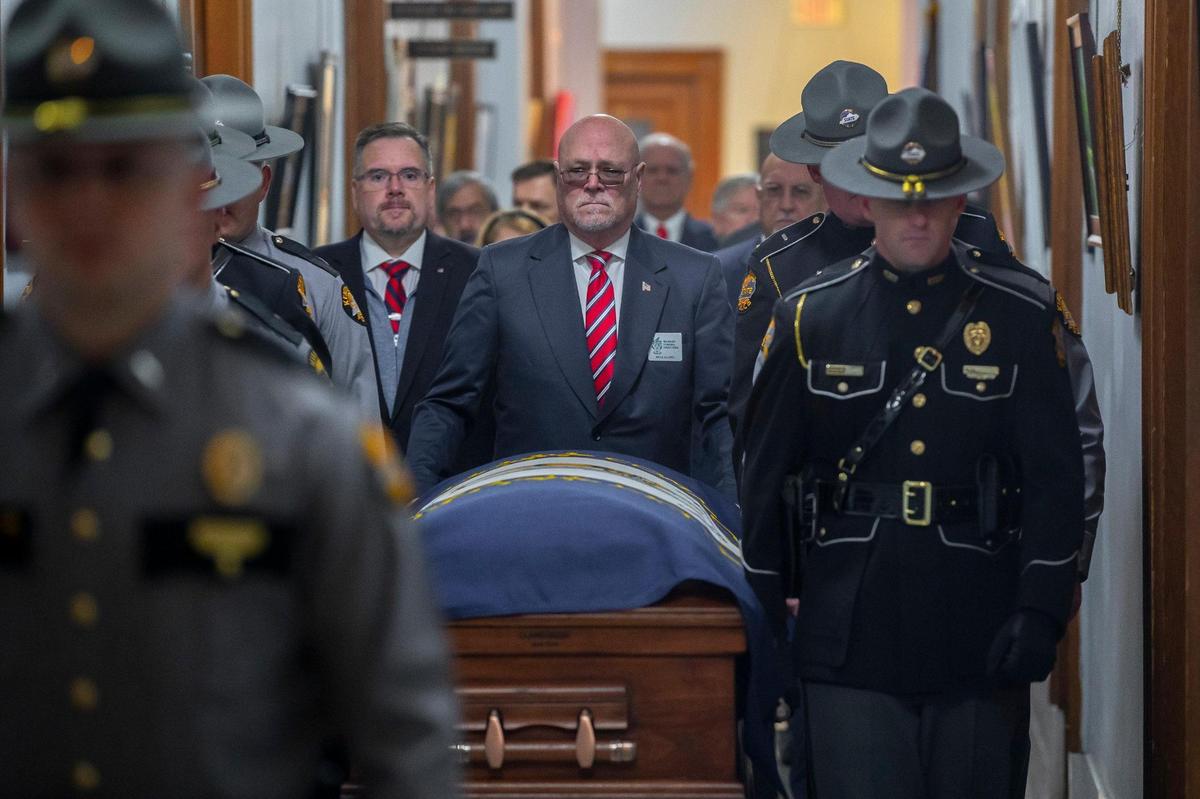 Members of the Kentucky State Police Honor Guard bring the casket of former Kentucky governor John Y. Brown into the state Capitol in Frankfort, Ky., on Tuesday, Nov. 29, 2022. Brown, a Democrat, was the 55th Governor of the commonwealth, serving from December 1979 to December 1983. Brown lied in state in the Capitol rotunda on Tuesday.