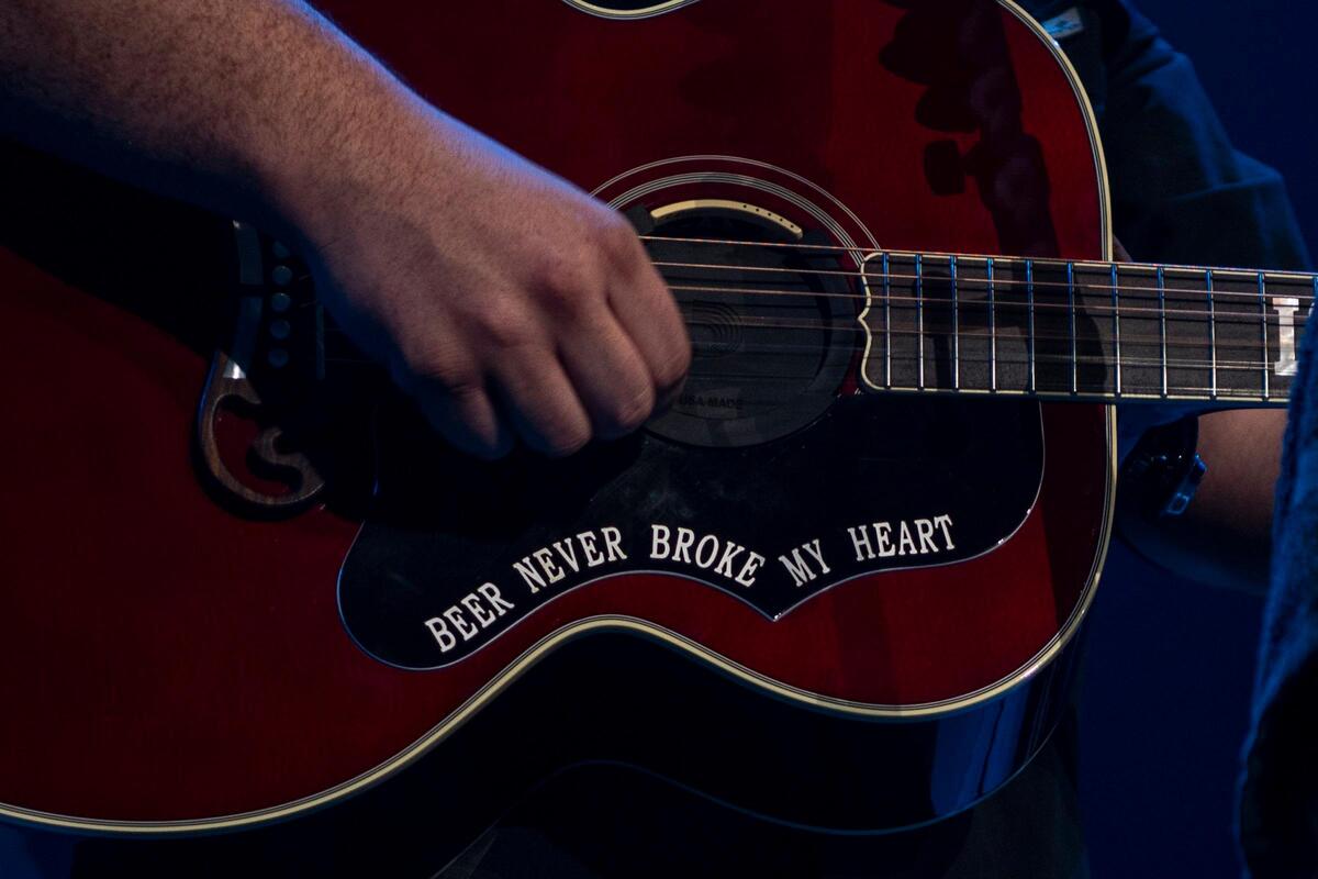 Luke Combs' guitar referenced his megahit “Beer Never Broke My Heart.”