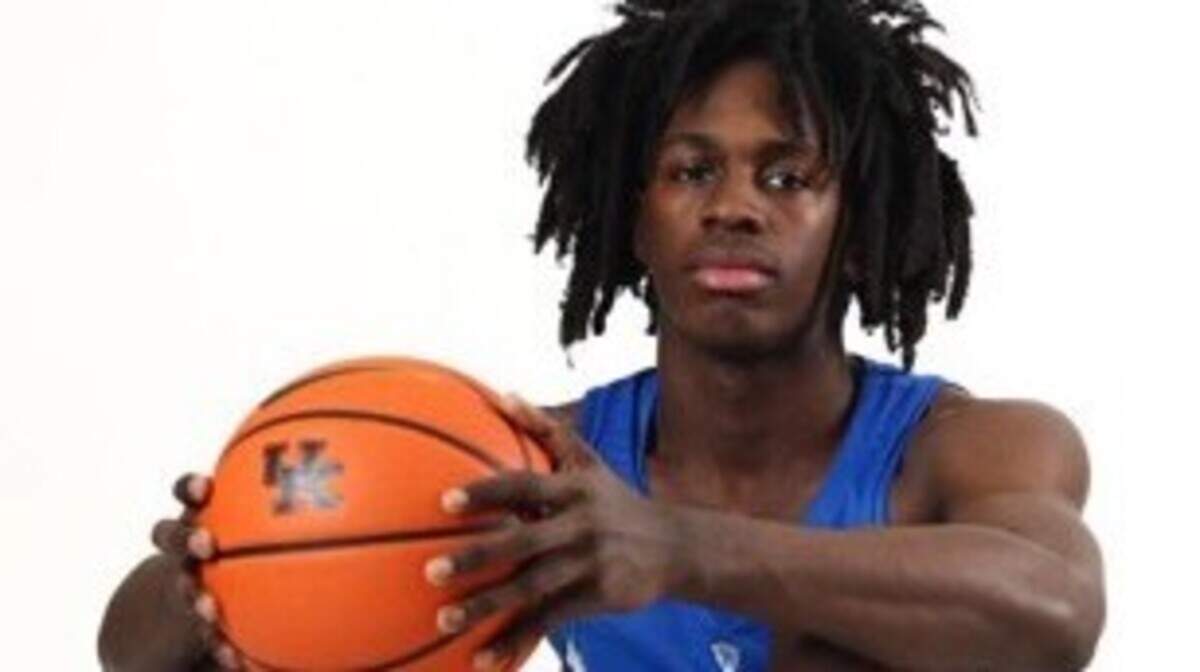 Kentucky men’s basketball recruit Ian Jackson posed for photos in a UK uniform during his visit to UK for Big Blue Madness in October 2022. Jackson is expected to announce his college commitment on Monday.