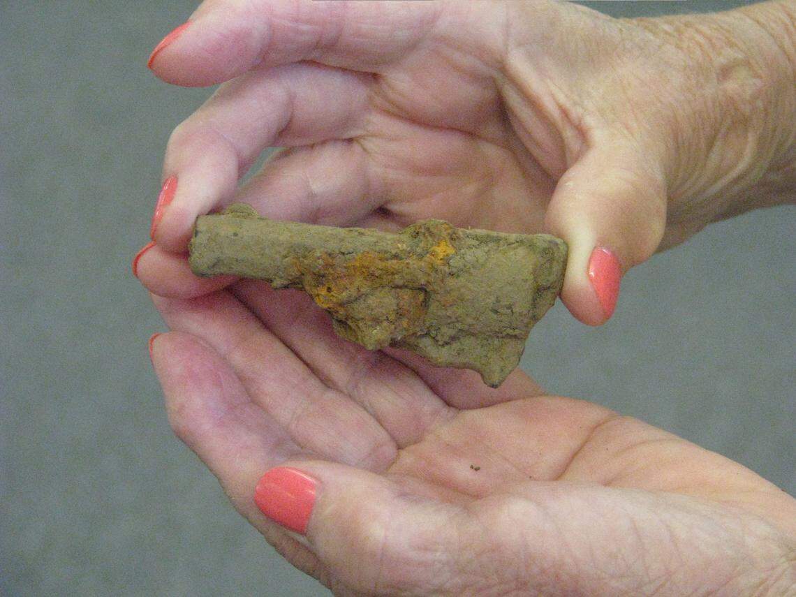 Gail Combs held a remnant of a small pistol that was found on property once owned by Jouett in Woodford County.
