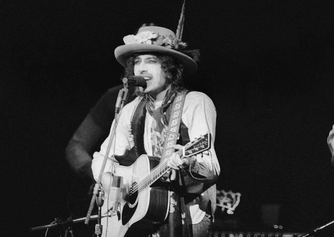 In this Dec. 8, 1975 file photo, Bob Dylan performed before a sold-out crowd in New York’s Madison Square Garden. Through constant re-invention, Dylan has remained relevant to music culture for seven decades.