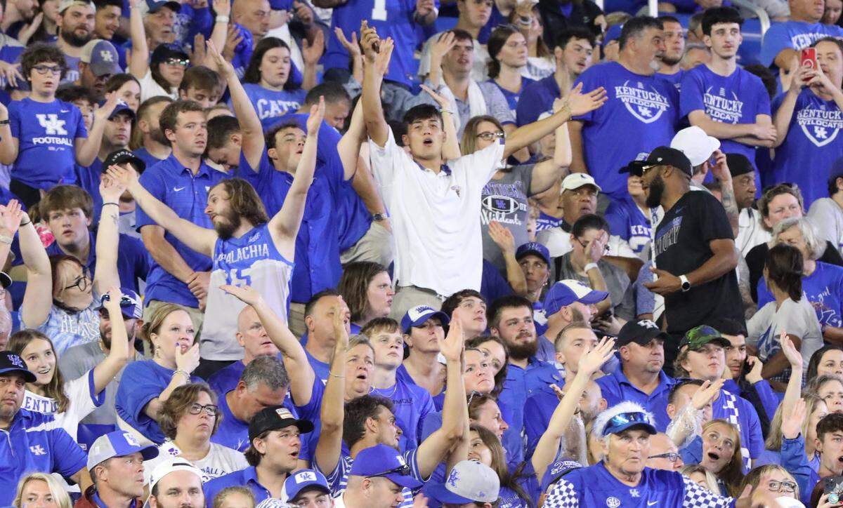 Kentucky fans join in singing “Y.M.C.A.” during the team’s game against Southern Miss at Kroger Field on Aug. 31.