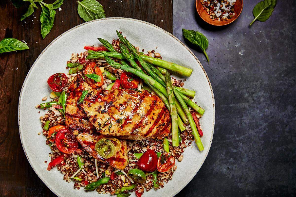 Besides steaks, Firebirds Wood Fired Grill also serves dishes such as the Honey Garlic Chicken with a grain salad.